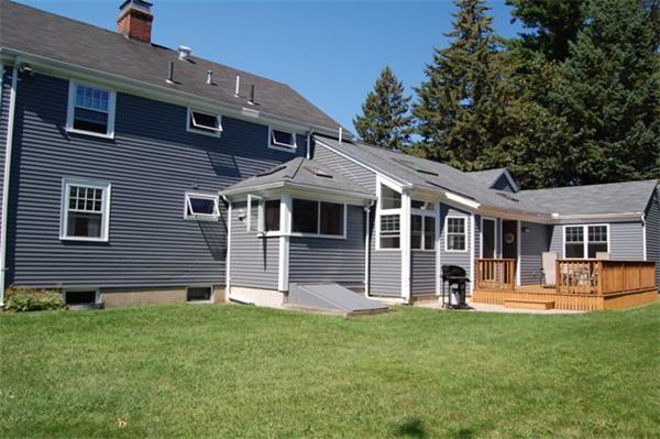 32 Sherburne Road Lexington, MA 02421 - Photo 23 of 24 a front view of a house with a yard