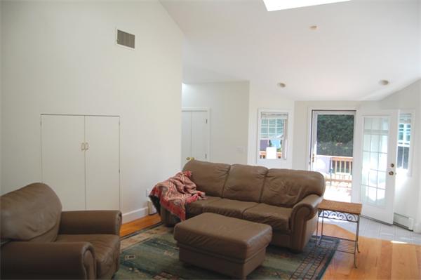 32 Sherburne Road Lexington, MA 02421 - Photo 6 of 24 a living room with a couch and a window