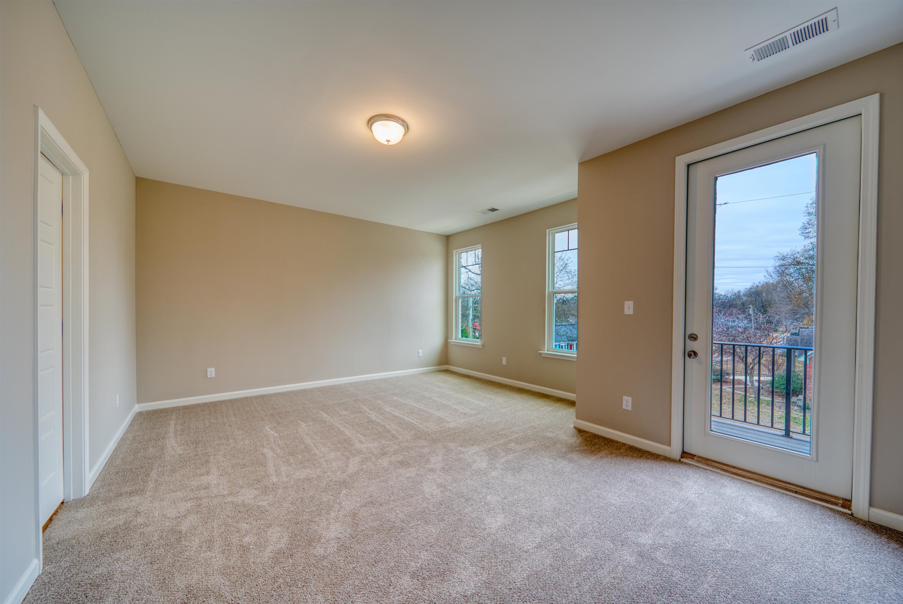 296 East Washington Avenue Covington, TN 38019 - Photo 25 of 38 a view of an empty room with glass door