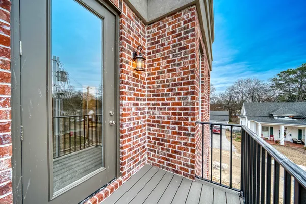 a view of balcony with wooden floor