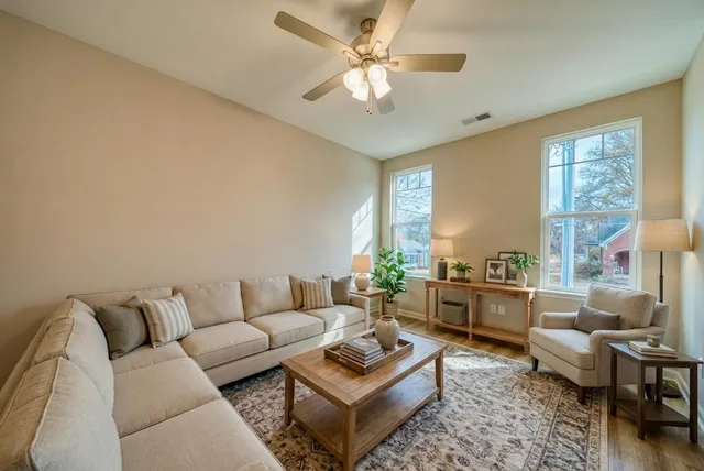 a living room with furniture and a large window