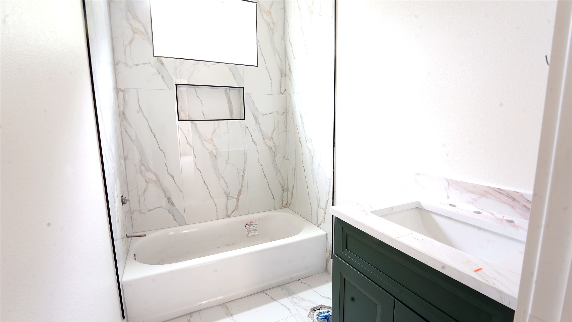 1313 Knight Street, Unit 1 Houston, TX 77022 - Photo 4 of 6 a bathroom with a bathtub and a sink