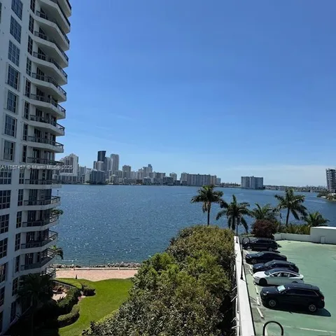 a view of a lake with a tall building