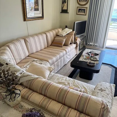 a living room with a couch and a flat screen tv