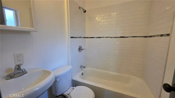 a bathroom with a sink and a bathtub