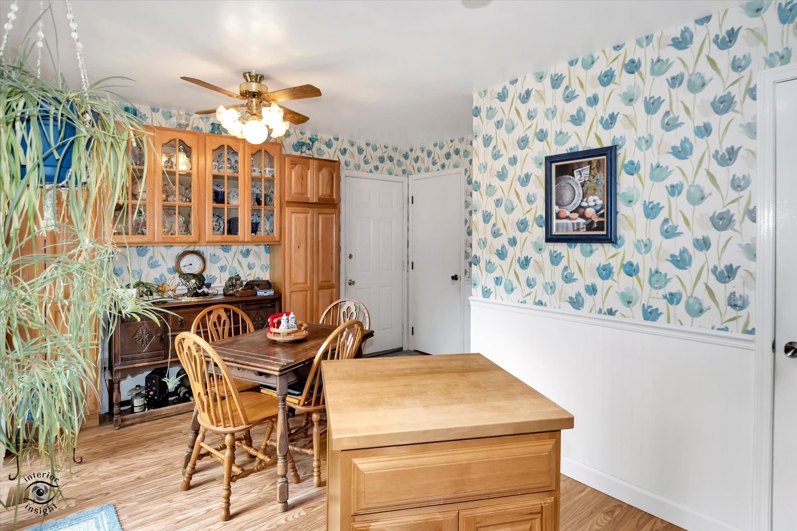 605 Ridge Street Wilmington, IL 60481 - Photo 12 of 26 a room with chandelier fan and wooden floor