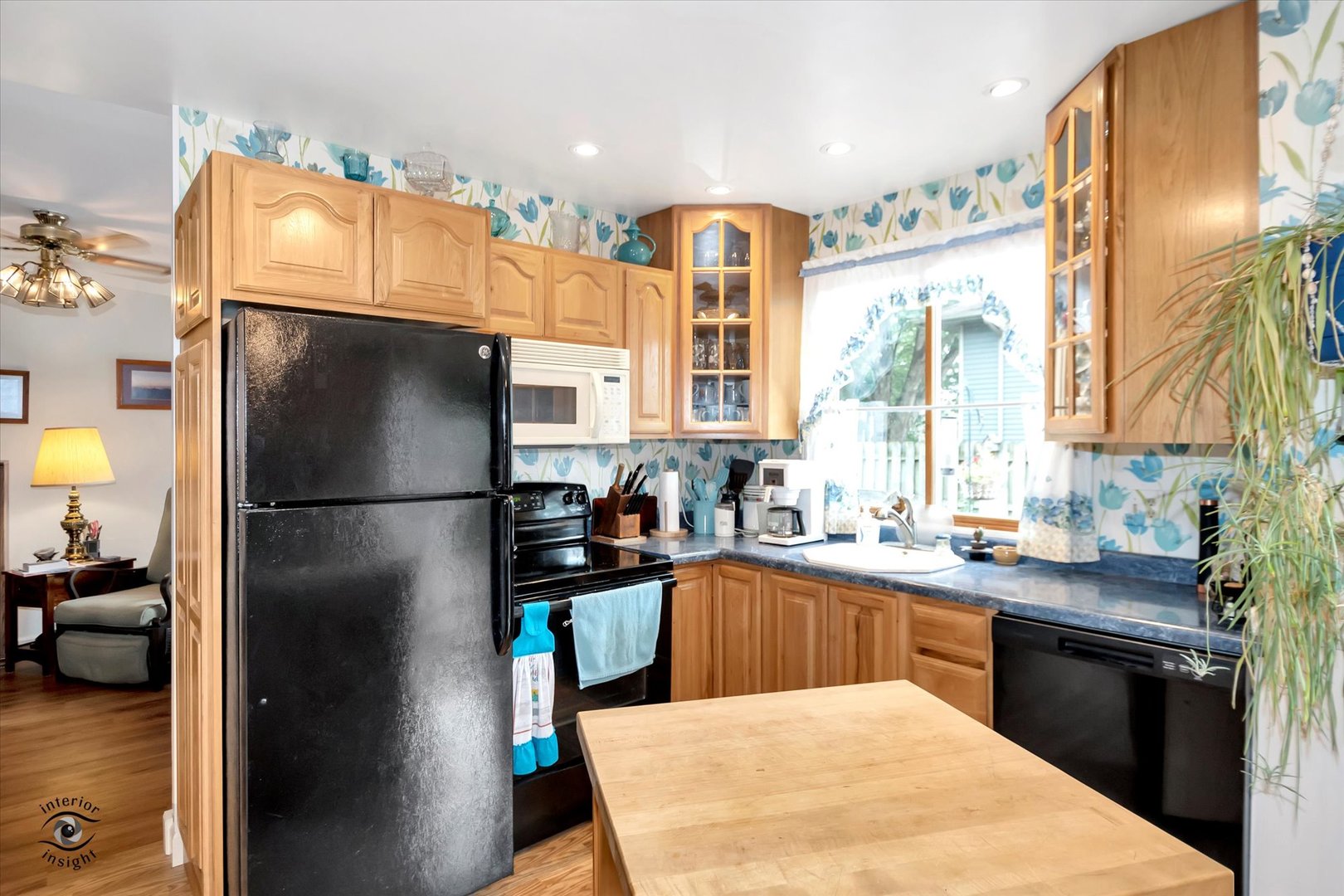 605 Ridge Street Wilmington, IL 60481 - Photo 15 of 26 a kitchen with stainless steel appliances granite countertop a refrigerator a sink a stove and a refrigerator