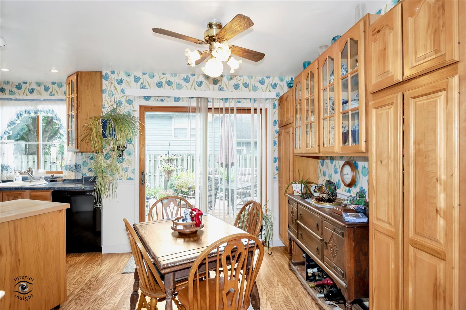 605 Ridge Street Wilmington, IL 60481 - Photo 16 of 26 a dining room with furniture a chandelier and a wooden floor