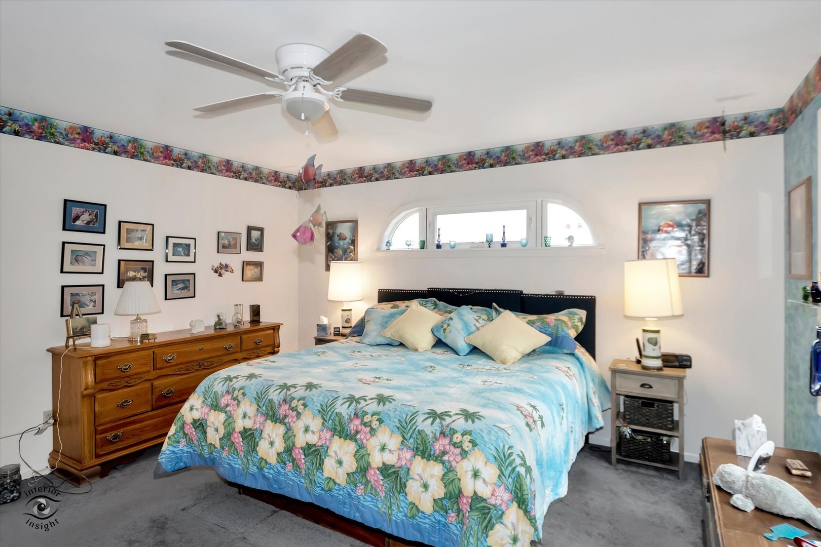 605 Ridge Street Wilmington, IL 60481 - Photo 19 of 26 a bedroom with a bed and a chandelier