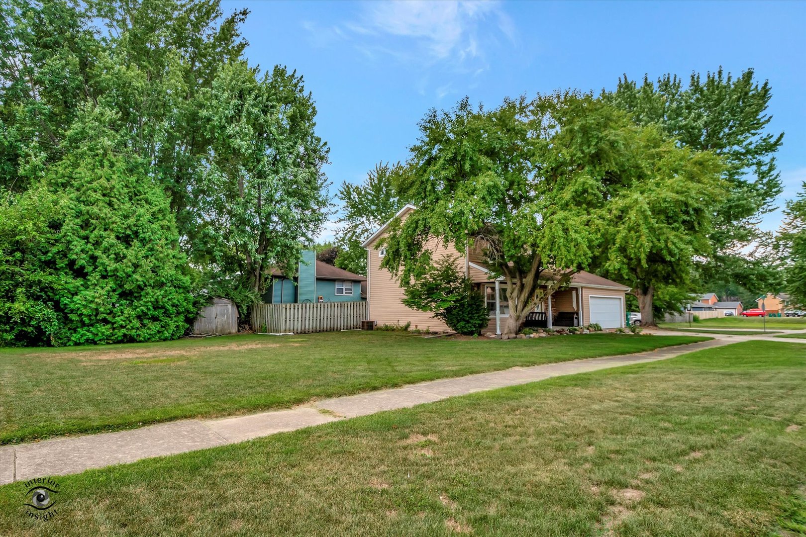605 Ridge Street Wilmington, IL 60481 - Photo 2 of 26 a view of a house with a big yard and large trees