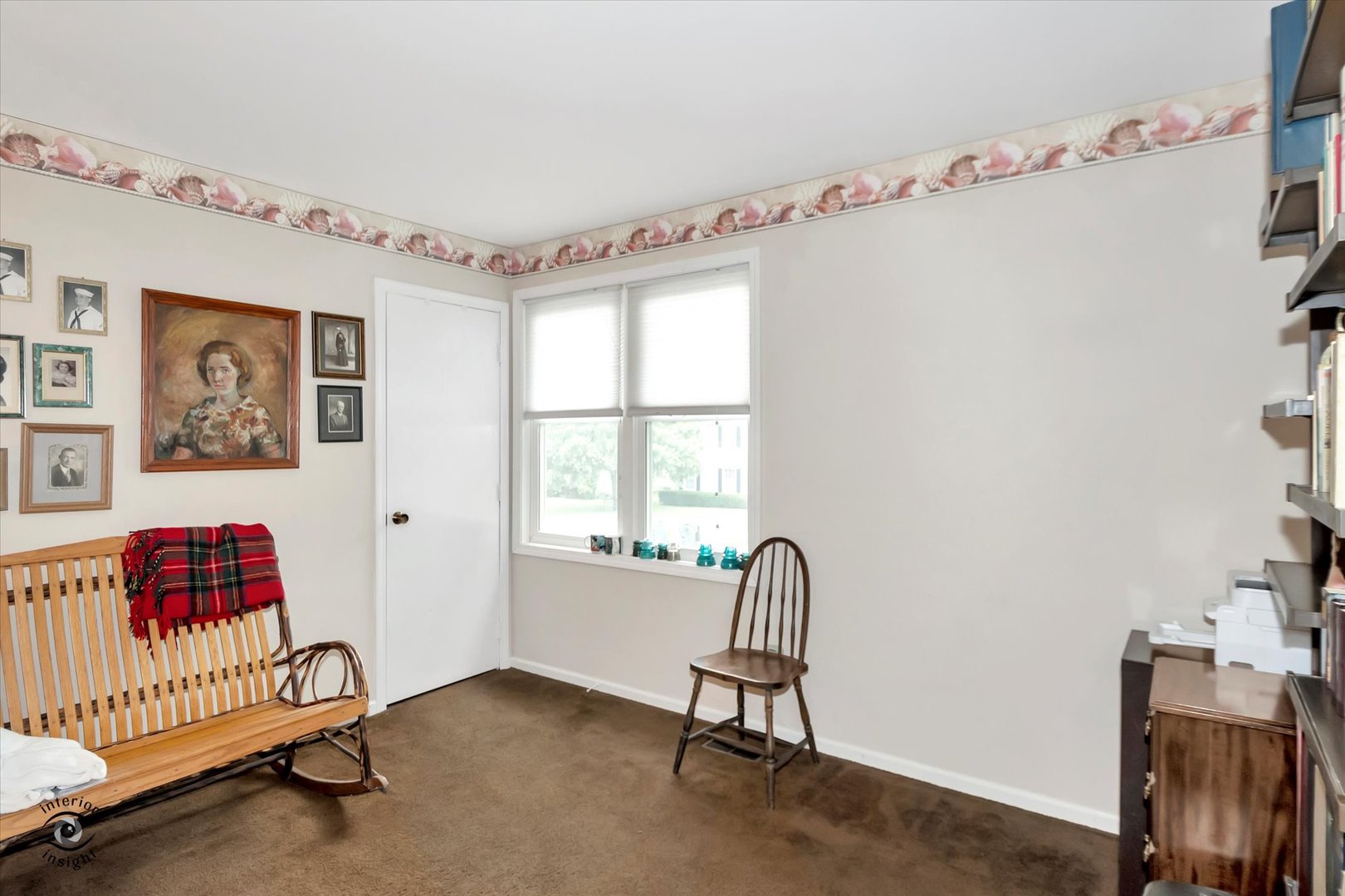 605 Ridge Street Wilmington, IL 60481 - Photo 24 of 26 a view of a bedroom with baby crib and a window