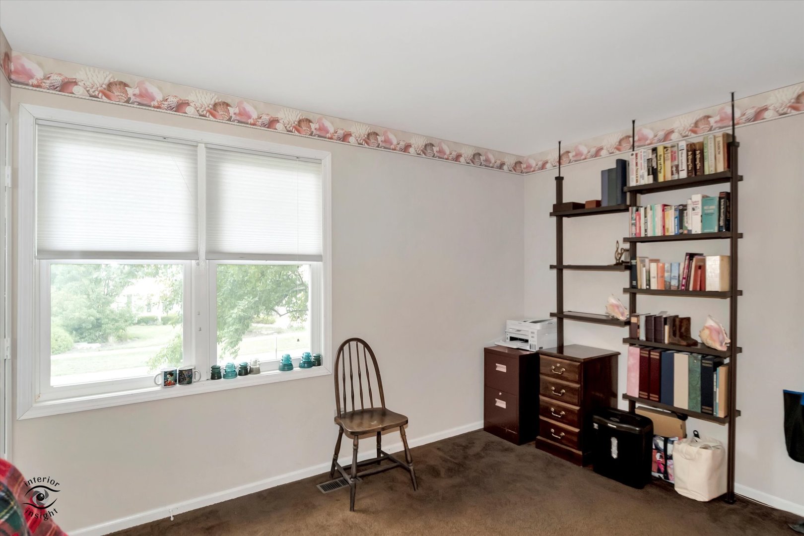 605 Ridge Street Wilmington, IL 60481 - Photo 25 of 26 a view of a workspace with furniture and a window
