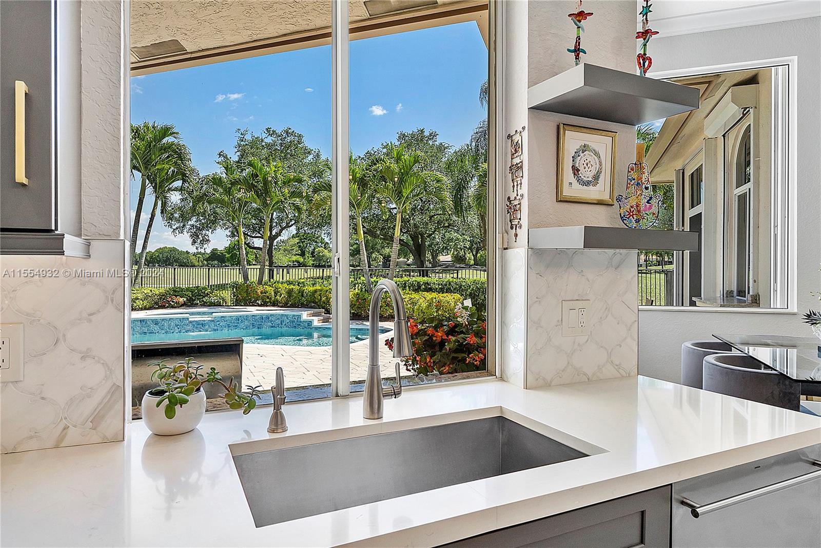 2539 Eagle Run Drive Weston, FL 33327 - Photo 18 of 64 a kitchen with a table and chairs