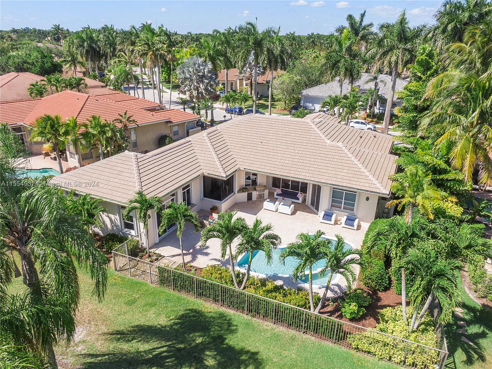 2539 Eagle Run Drive Weston, FL 33327 - Photo 2 of 64 an aerial view of a house with a garden