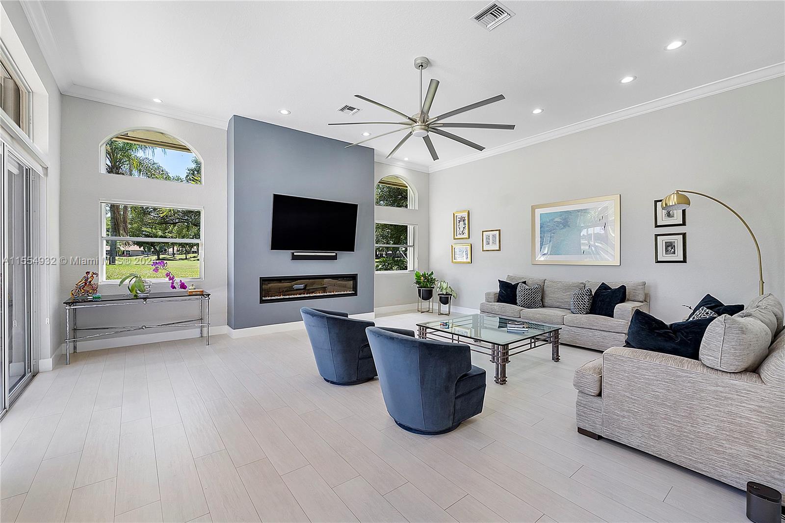 2539 Eagle Run Drive Weston, FL 33327 - Photo 26 of 64 a living room with furniture a flat screen tv and a window