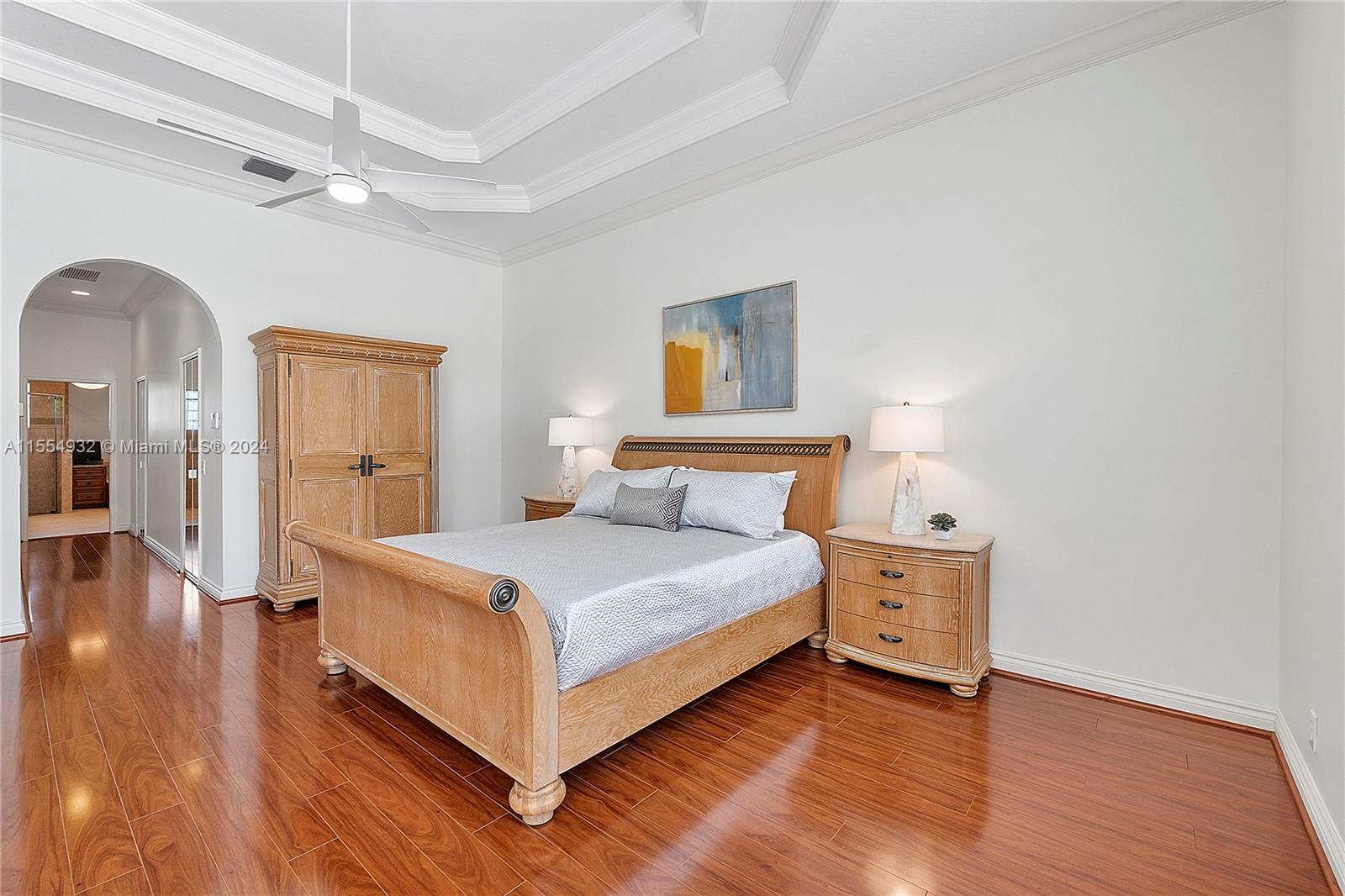 2539 Eagle Run Drive Weston, FL 33327 - Photo 35 of 64 a bedroom with a bed and a chandelier