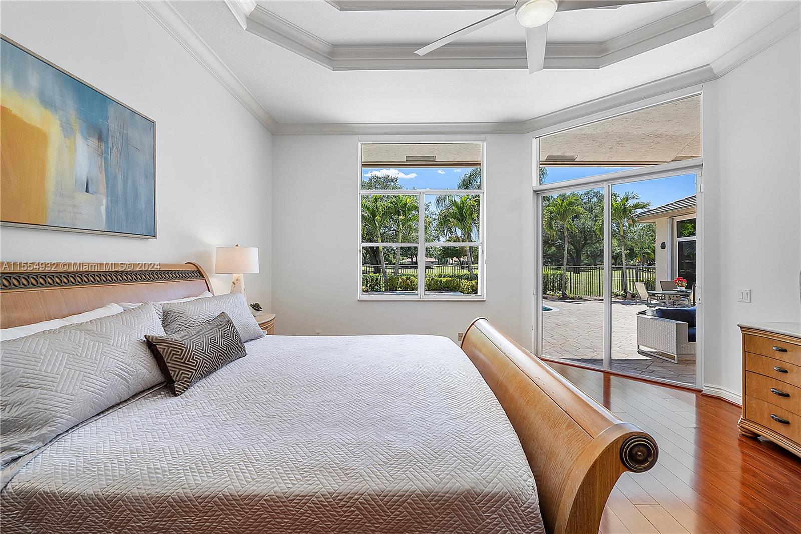 2539 Eagle Run Drive Weston, FL 33327 - Photo 36 of 64 a bedroom with a bed and large windows