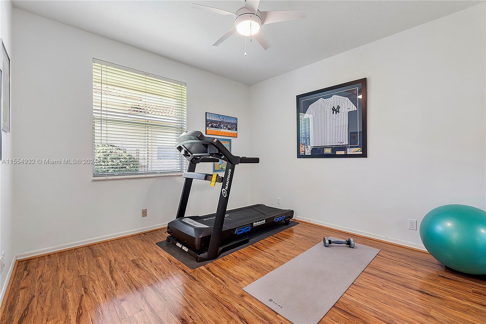 2539 Eagle Run Drive Weston, FL 33327 - Photo 41 of 64 a room with gym equipment and a window