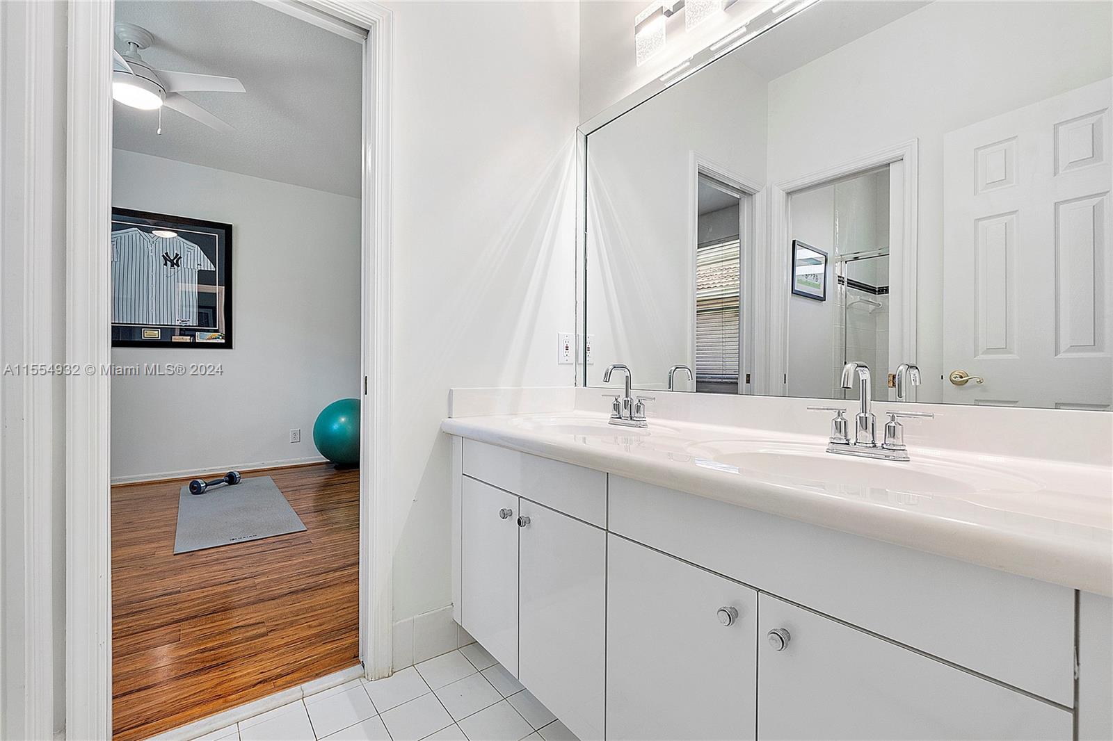 2539 Eagle Run Drive Weston, FL 33327 - Photo 43 of 64 a bathroom with a sink double vanity and a mirror