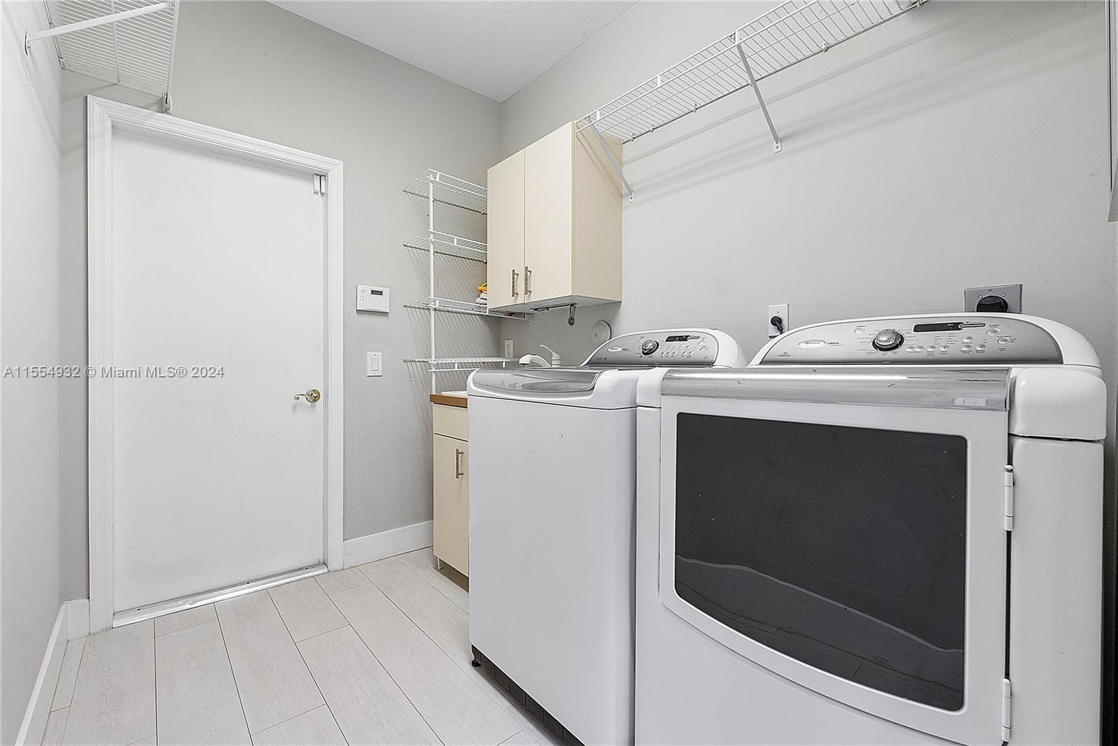 2539 Eagle Run Drive Weston, FL 33327 - Photo 47 of 64 a utility room with dryer and washer