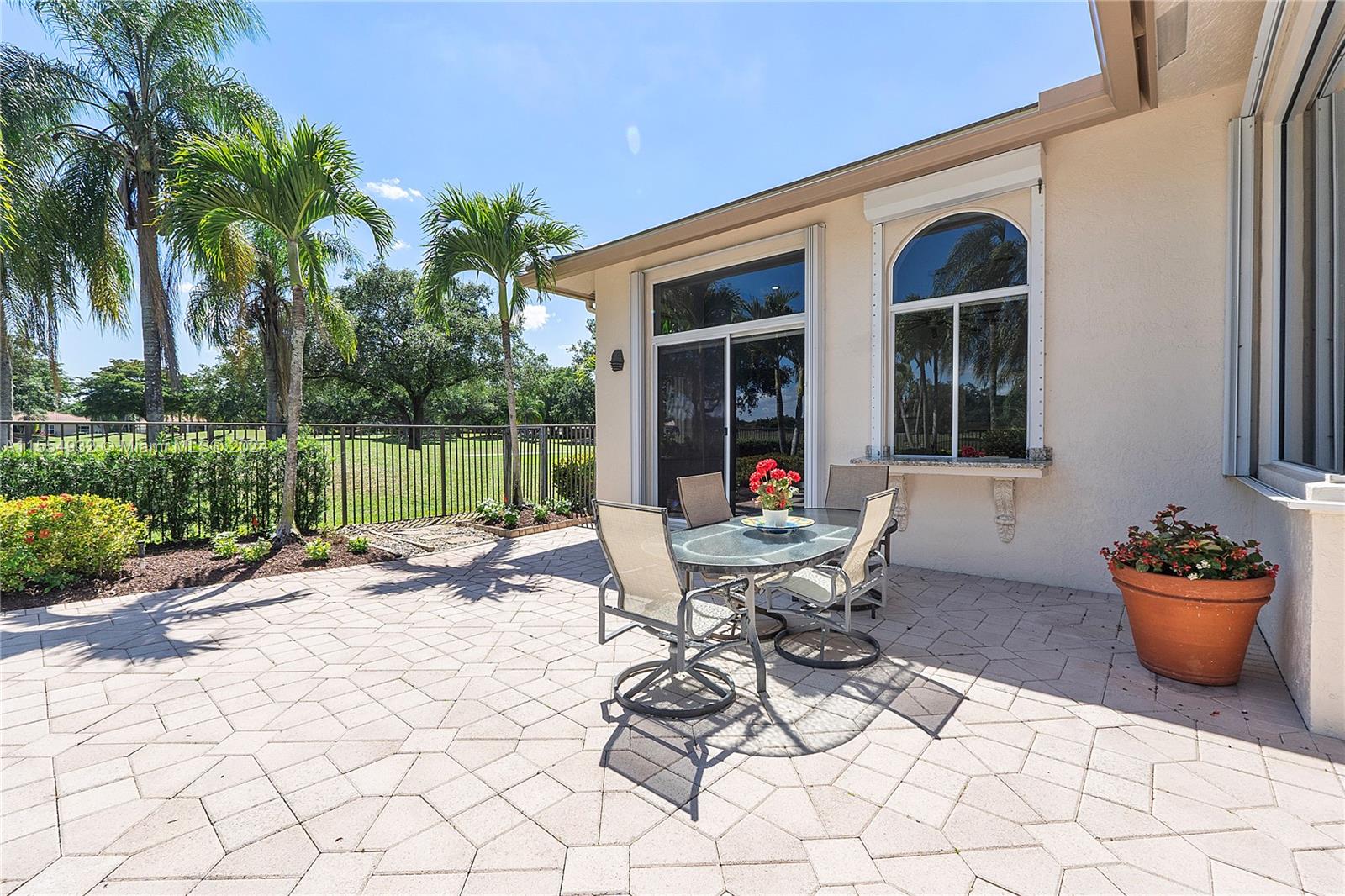2539 Eagle Run Drive Weston, FL 33327 - Photo 51 of 64 a view of a chair and table in backyard of the house