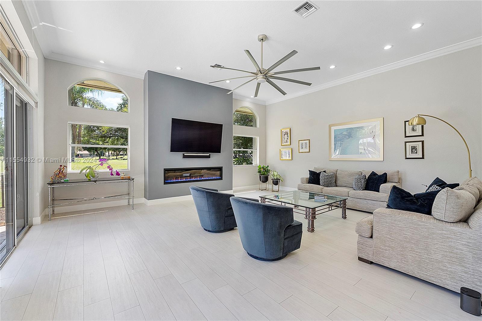 2539 Eagle Run Drive Weston, FL 33327 - Photo 6 of 64 a living room with furniture a window and a flat screen tv