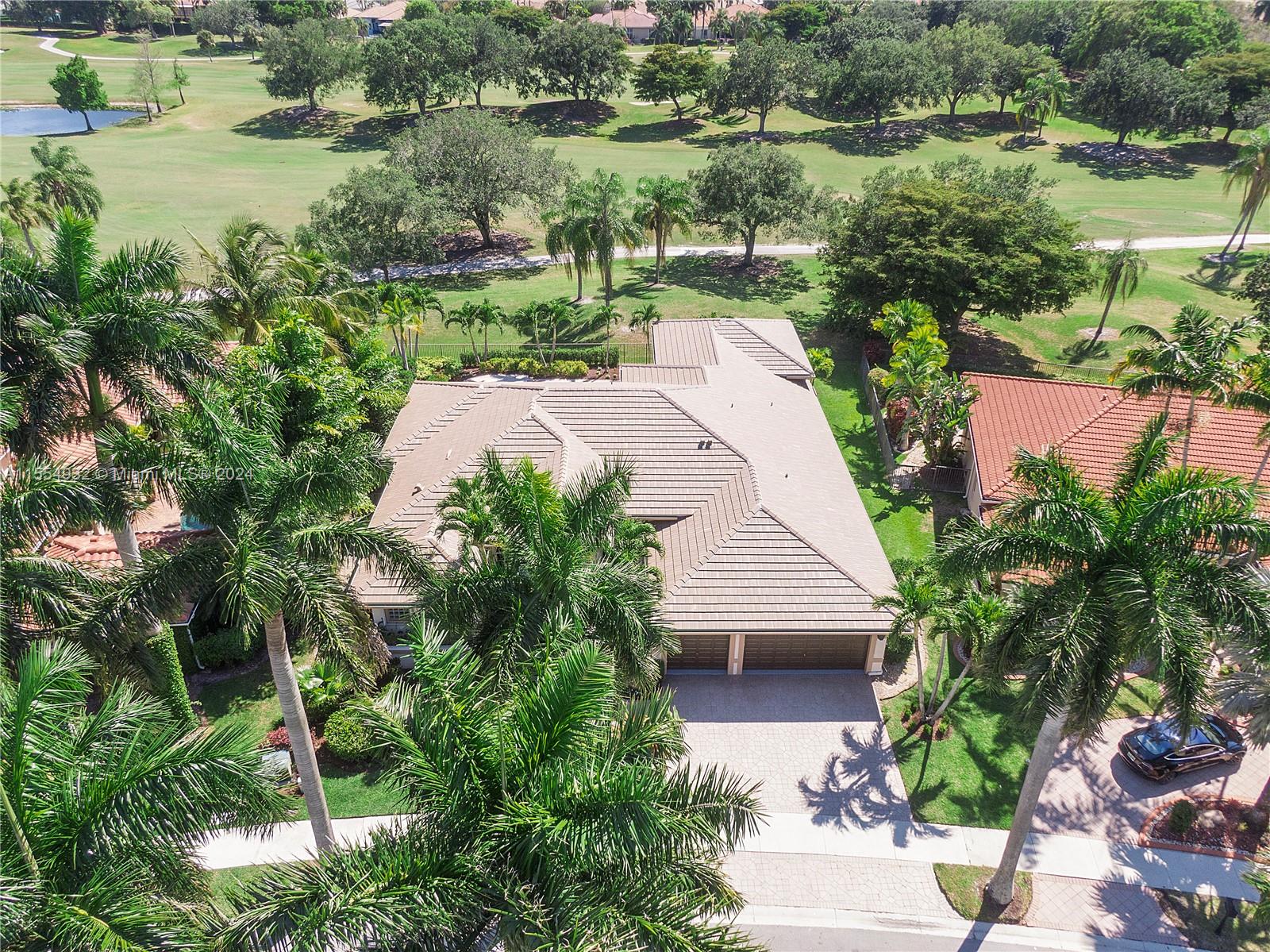 2539 Eagle Run Drive Weston, FL 33327 - Photo 63 of 64 an aerial view of a house with yard and lake view