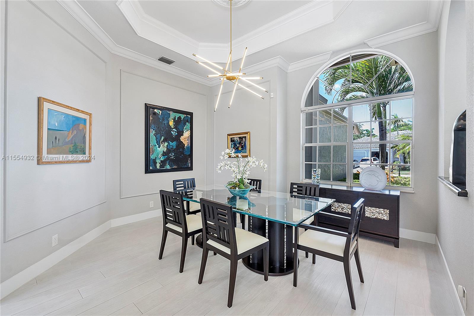 2539 Eagle Run Drive Weston, FL 33327 - Photo 8 of 64 a dining room with furniture a chandelier and a rug