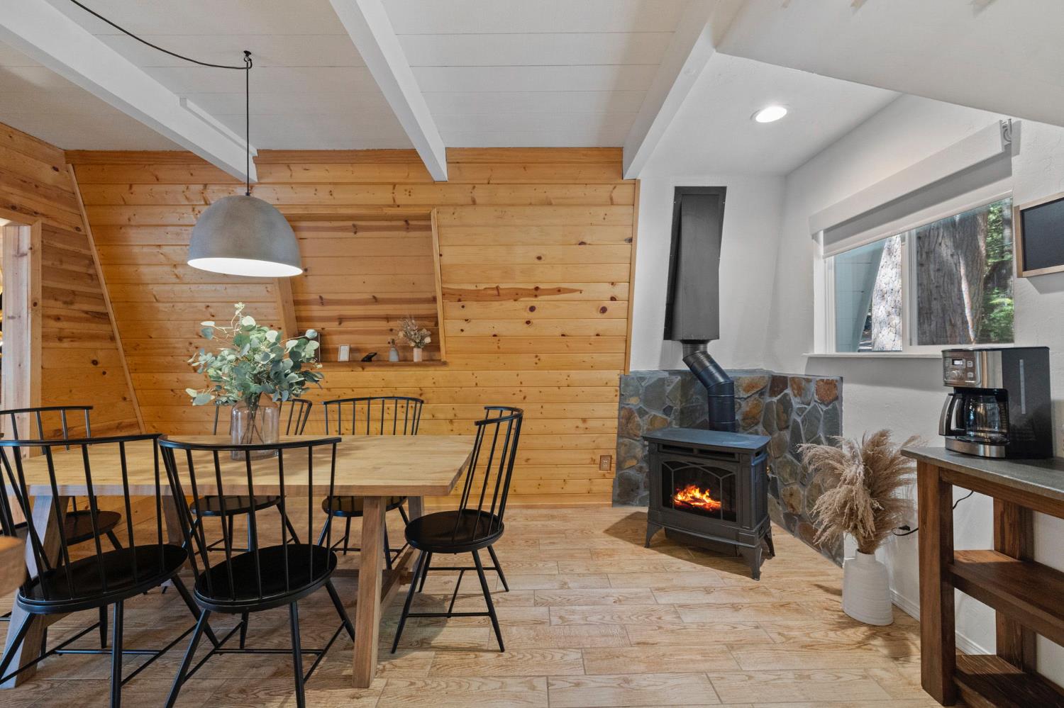22785 West Ellmaro Road Long Barn, CA 95335 - Photo 12 of 28 a dining room with furniture and a fireplace