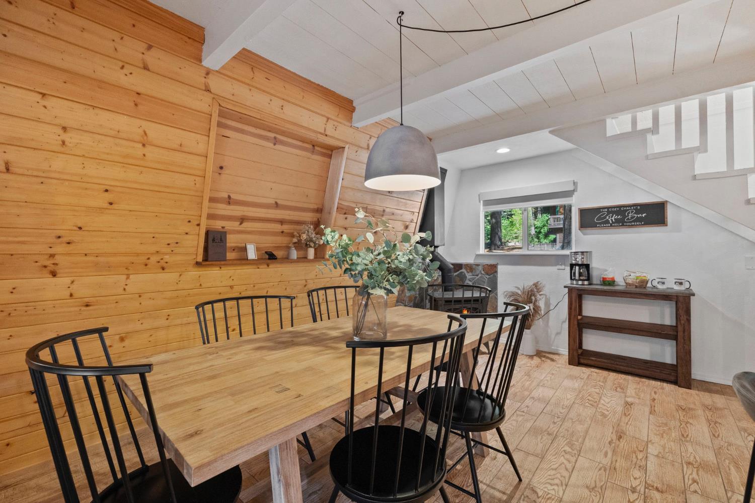 22785 West Ellmaro Road Long Barn, CA 95335 - Photo 13 of 28 a view of a dining room and livingroom with furniture wooden floor a chandelier