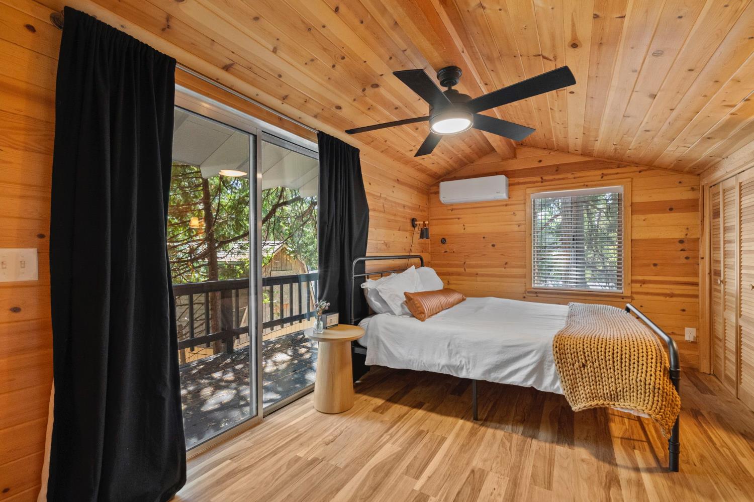 22785 West Ellmaro Road Long Barn, CA 95335 - Photo 24 of 28 a bedroom with a bed and wooden floor