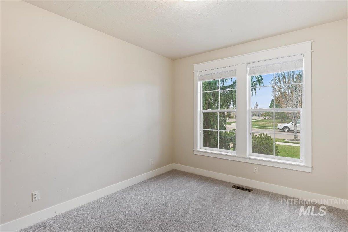 1366 North Waterbrook Way Star, ID 83669 - Photo 19 of 30 Spare room featuring baseboards and light colored carpet