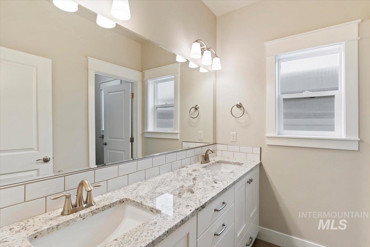 1366 North Waterbrook Way Star, ID 83669 - Photo 21 of 30 Full bathroom with tasteful backsplash and double vanity