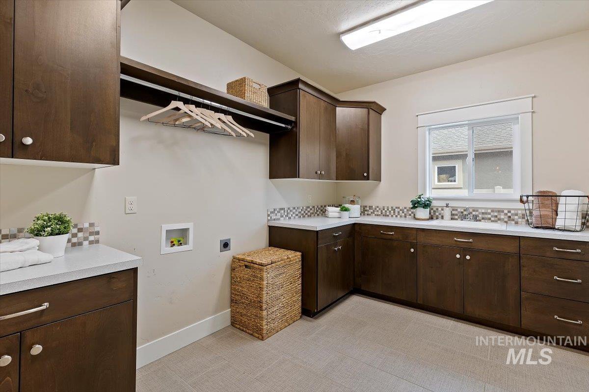 1366 North Waterbrook Way Star, ID 83669 - Photo 26 of 30 Laundry area with washer hookup, cabinet space, and electric dryer hookup