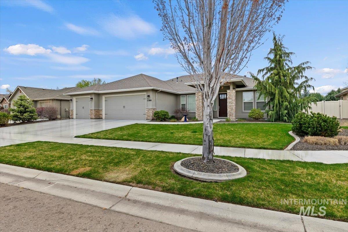 1366 North Waterbrook Way Star, ID 83669 - Photo 3 of 30 Single story home featuring an attached garage, driveway, stucco siding, and stone siding