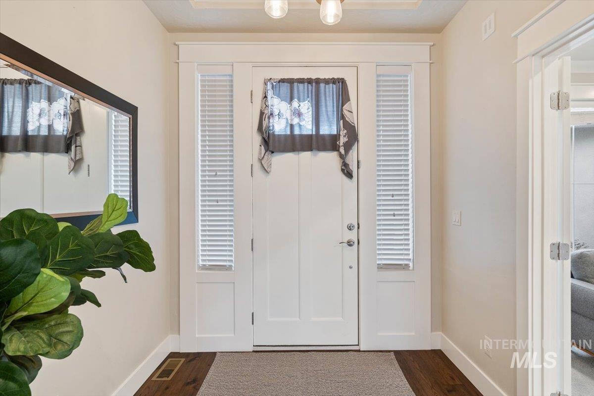 1366 North Waterbrook Way Star, ID 83669 - Photo 5 of 30 Foyer entrance featuring dark wood-style floors and baseboards