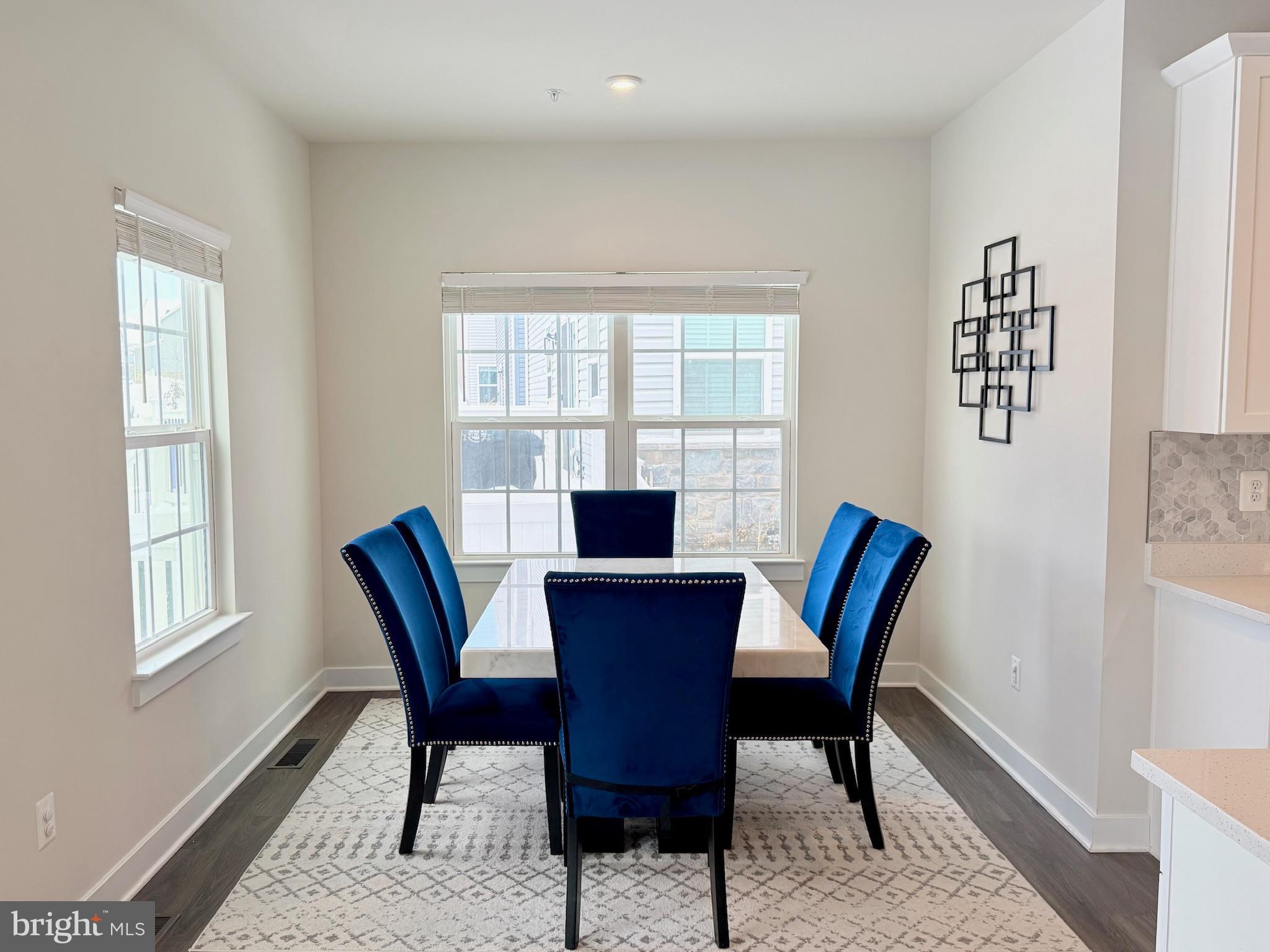 11360 Wheeler Ridge Drive Manassas, VA 20109 - Photo 4 of 32 Bright dining area with elegant blue accents.
