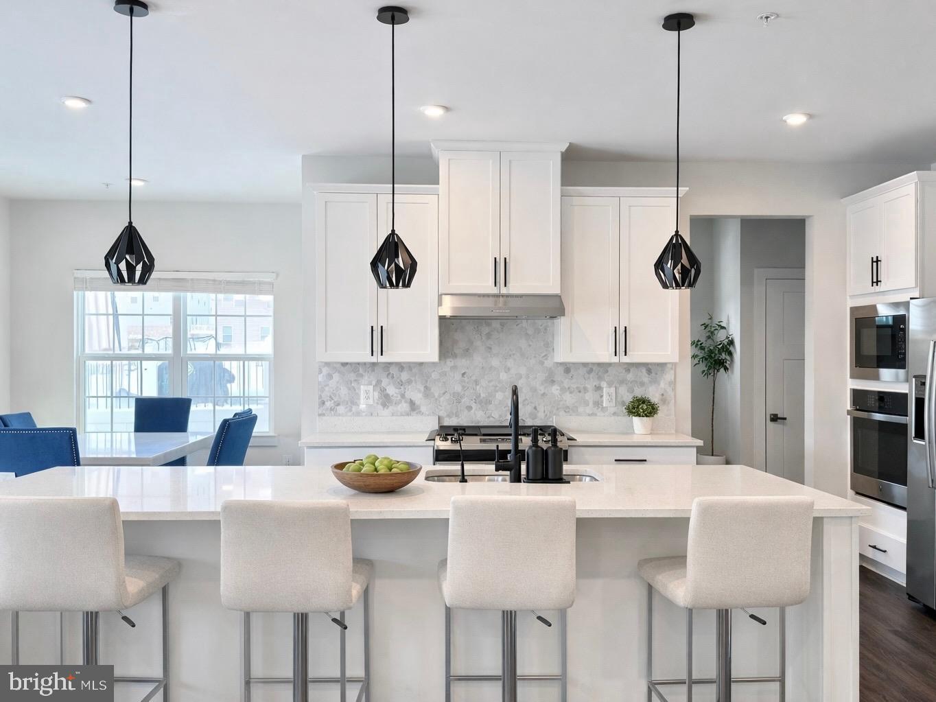 11360 Wheeler Ridge Drive Manassas, VA 20109 - Photo 6 of 32 Sleek modern kitchen with elegant finishes.
