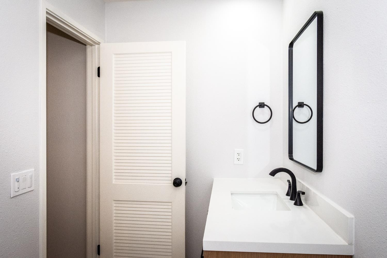 427 Wyndgate Road Sacramento, CA 95864 - Photo 18 of 36 a bathroom with a sink a mirror and shower