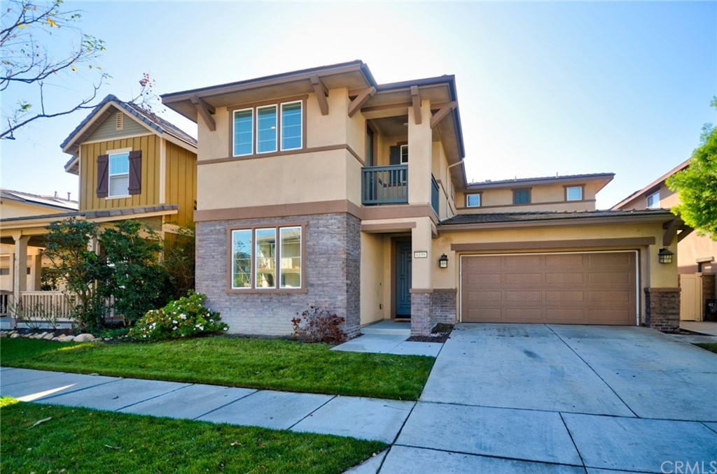 6199 Castleton Street Chino, CA 91710 - Photo 1 of 1 a front view of a house with garden