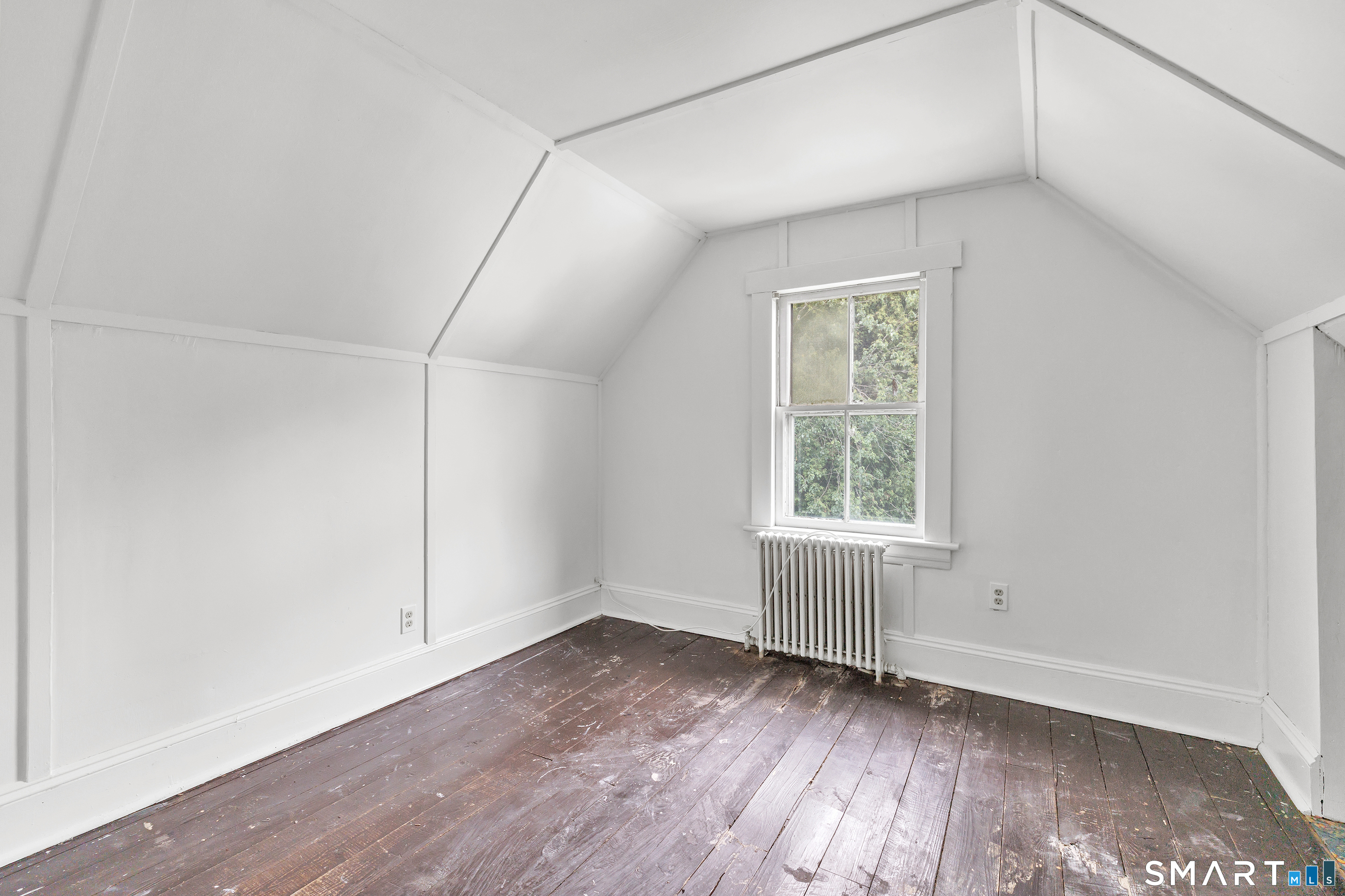 1326 Huntington Road Stratford, CT 06614 - Photo 29 of 37 3rd Bedroom is located in the Walk up Attic - Freshly painted and has original wooden floors
