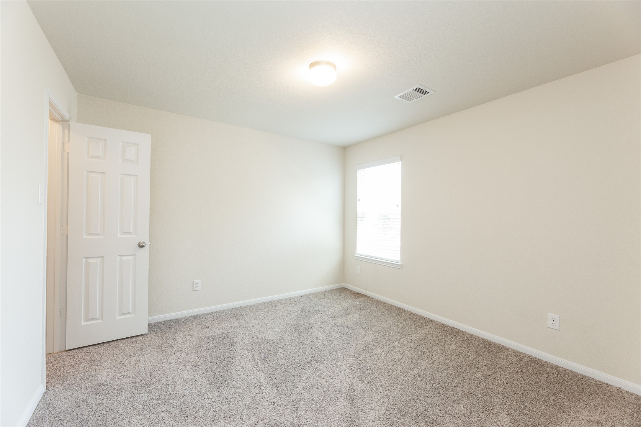 2293 Garden Square Path Spring, TX 77386 - Photo 25 of 32 a view of an empty room and a window
