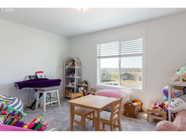 a living room with furniture a window and a table