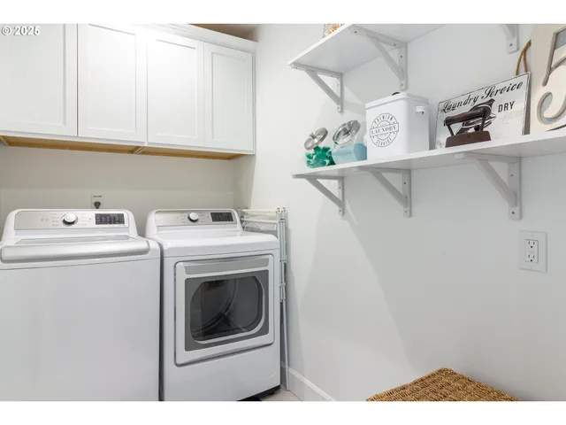 a bedroom with a bed a dresser and potted plants on the dresser