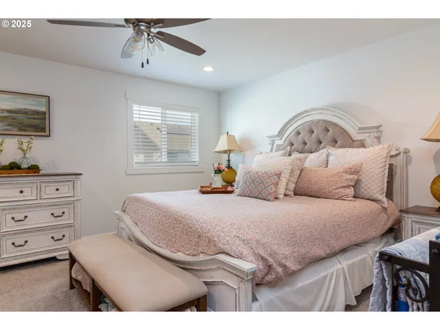 a bedroom with a bed and a television