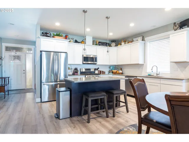 a bathroom with a shower sink and mirror