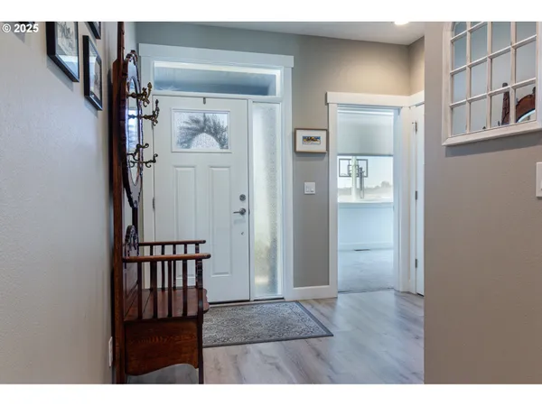 a view of entryway with wooden floor