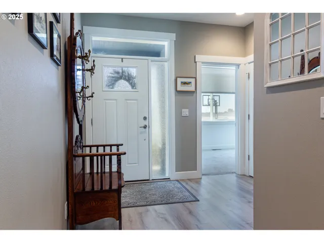 a view of entryway with wooden floor