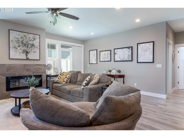 a living room with furniture and a fireplace
