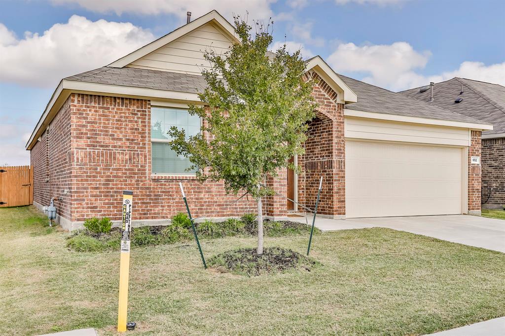 652 Ridgeback Trail Fort Worth, TX 76052 - Photo 2 of 20 View of front of house featuring a garage and a front lawn